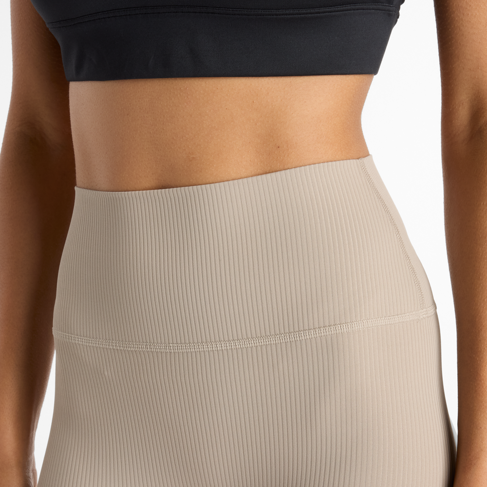 Legginsy damskie New Balance WP53152ADS – beżowe