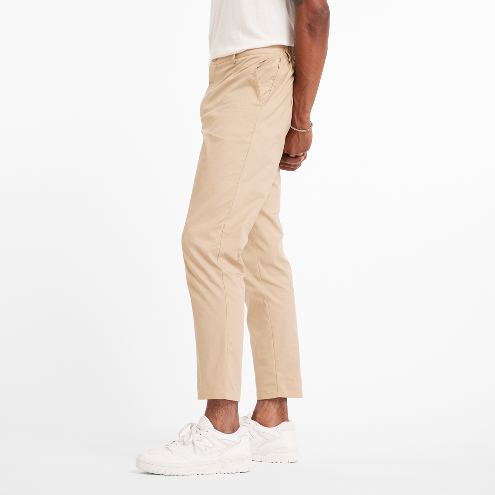 Spodnie męskie New Balance MP43554SOT – beżowe