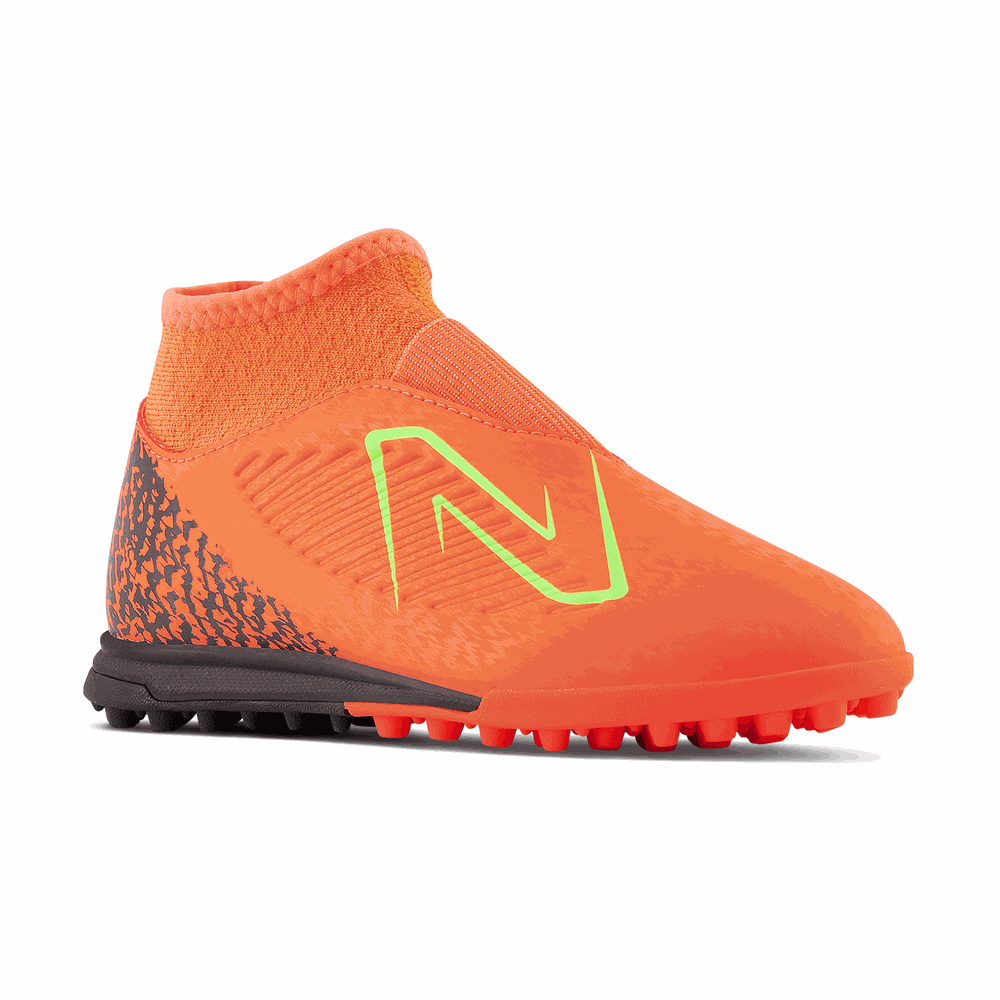 Turfy dziecięce New Balance TEKELA V4 MAGIQUE JNR FG SJT3TDF4 – pomarańczowe