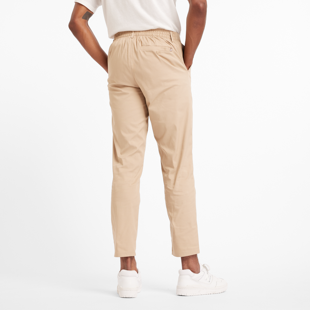 Spodnie męskie New Balance MP43554SOT – beżowe