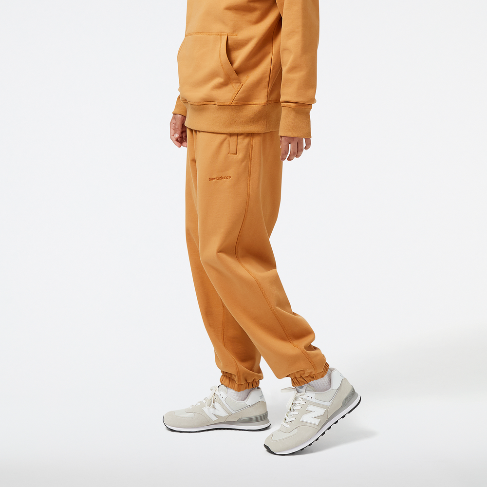 Spodnie męskie New Balance MP23551TOB – pomarańczowe