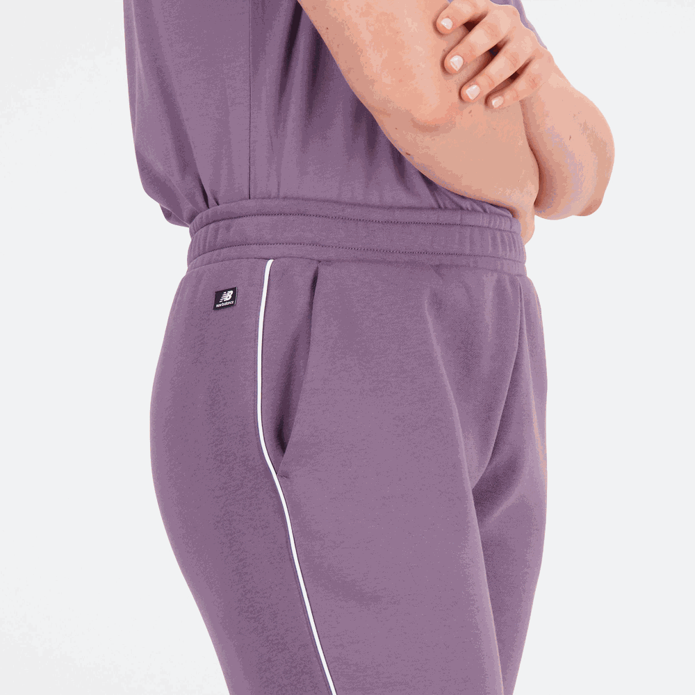 Spodnie damskie New Balance WP33509SHW – fioletowe